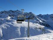 HochAlterBahn - 4pers.| Seggiovia ad alta velocità (ad agganciamento automatico) con cupole di protezione