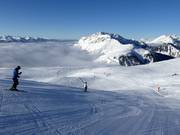 Sciare sopra le nuvole nel comprensorio sciistico Alpe Lusia