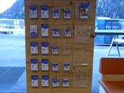 Esposizione gratuita di mappe delle piste nell'area delle casse