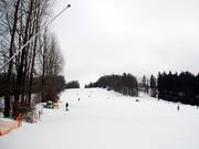 L'ampio pendio finale sopra la stazione a valle
