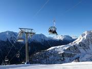 Alblittkopfbahn - 4pers.| Seggiovia ad alta velocità (ad agganciamento automatico) con cupole di protezione