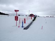 Pista pratica con tappeto mobile alla stazione a valle