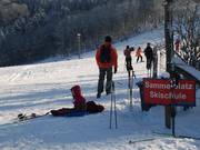 Punto di raccolta presso il tappeto roulant