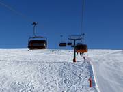 Campo-Lastè - 4pers.| Seggiovia ad alta velocità (ad agganciamento automatico) con cupole di protezione