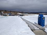 Pista per principianti con tappeto mobile alla stazione a valle della cabinovia