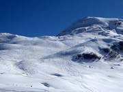 Pendii di neve fresca tra Alpetli e Tamboalp