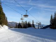 Santel-Meriz - 4pers.| Seggiovia ad alta velocità (ad agganciamento automatico) con cupole di protezione