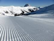 Tracce nella neve con panorama sul Rettenstein